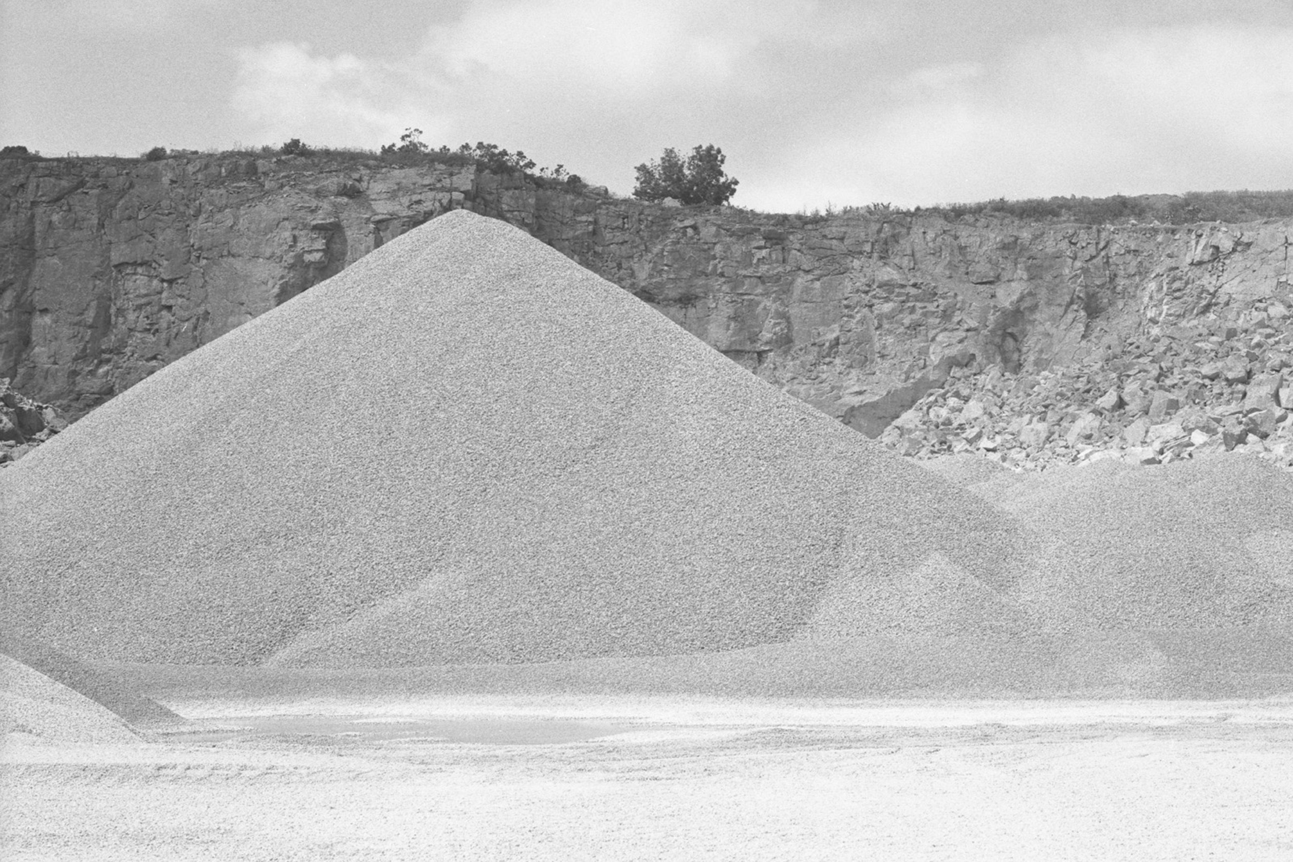 Rie Nakajima, Four Forms - black and white photo of piles of aggregate