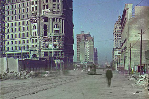 Cem Güney - three dots, a jaw, and a cul de sac, old photo of Instanbul showing tower blocks and a tramline