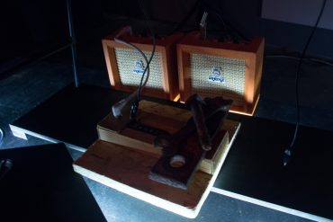 Apartment House - We are for a while, pile of scavenged junk wired to two little orange amplifiers