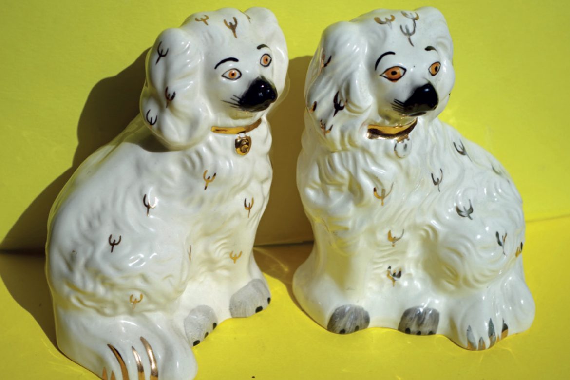 Angharad Davies and Tisha Mukarji - ffansïon fancies, two white china dogs against a bright yellow background