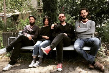 Taku Sugimoto - mada, Akama, Alvear, Bondi, d'incise sat outdoors on a bench, sunny day