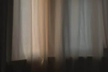 Kostis Kilymis - A Void, curtain with pale light filtering through