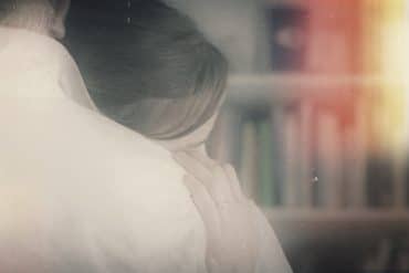 Marcus Fischer - Film Variations, still from film showing couple embracing in a domestic environment
