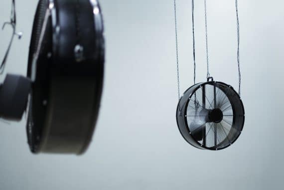 Jordan Edge - Acclimate, two industrial fans whirring against a blue-white background