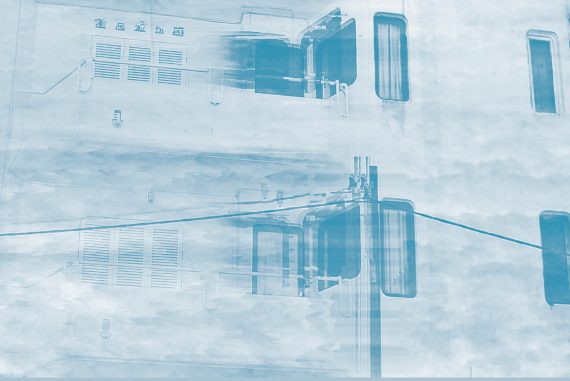 Ogive - Folds, image of a building and telegraph pole in light blue haze.