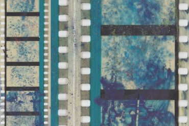 Grisha Shakhnes - ARCS, blue-tinted closeup of celluloid film