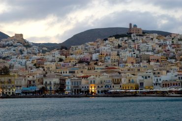 Michael Pisaro - Shades of Eternal Night, image of buildings lining the shore of the Aegean Sea in Ermoupoli, Syros, by Ross Berteig.