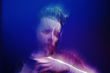Richard J Birkin - Last Outpost of Empire, image of artist manipulated to look as if he was underwater.