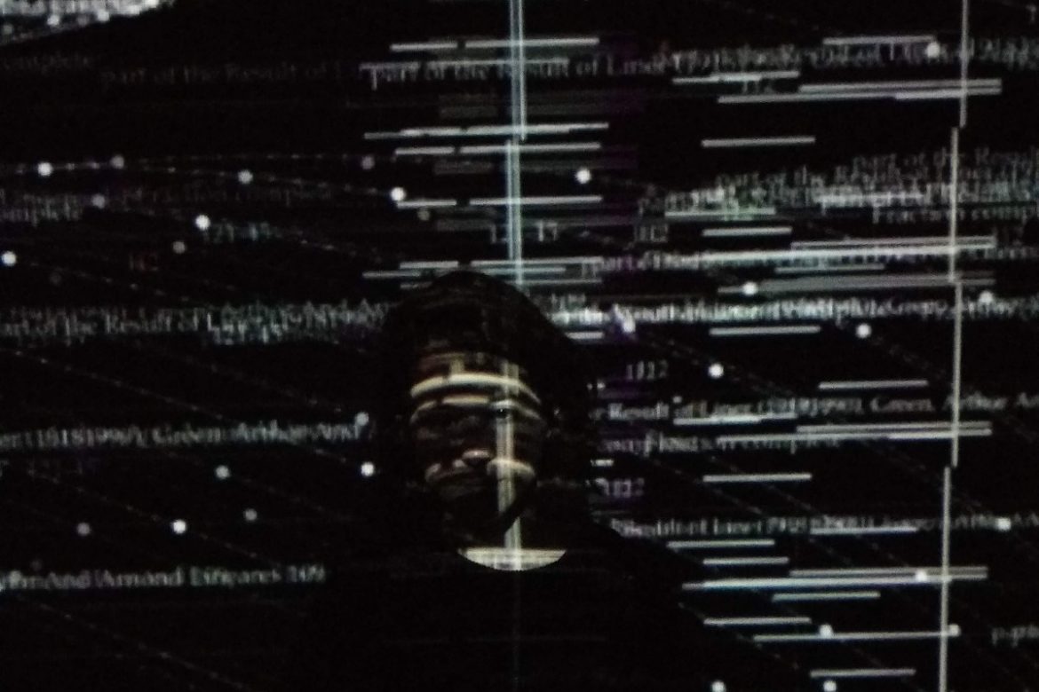 Laura León, artist against a black background overlaid with projections.